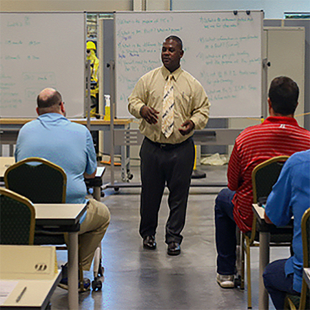 David Jackson, Principal Training Specialist for Production Operator Program teaching a class